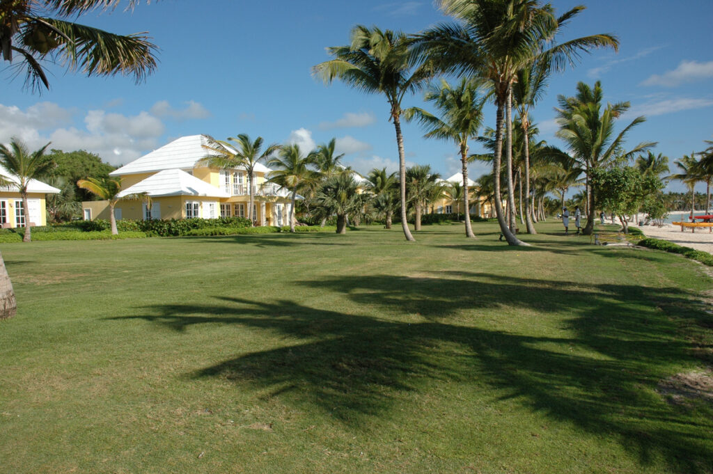 Yellow villas beside lawns, palms and the beach at Tortuga Bay in 2007.