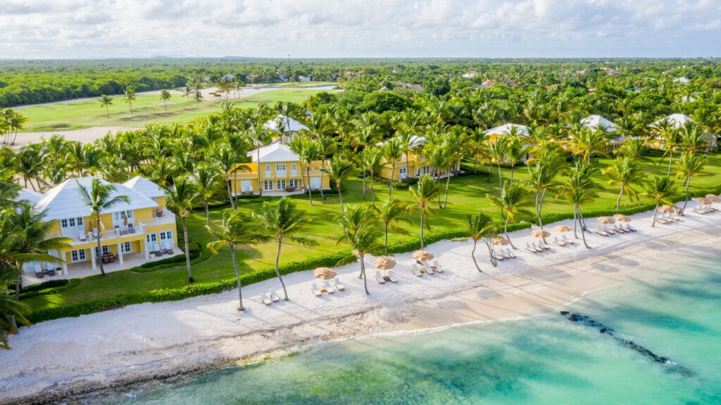Aerial view of Tortuga Bay’s villas and beach beside the Caribbean Sea.