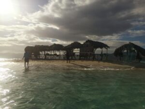 Thatched shelters stand on the little sandbank at Cayo Arena.