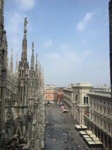 A view along the street from among Milan Cathedral’s rooftop spires.