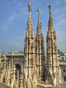 Ornate Gothic spires on the roof of Milan Cathedral.