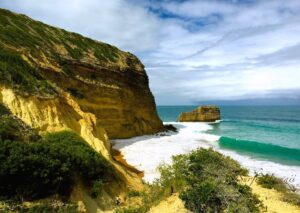 Golden cliffs and breaking waves at El Morro.