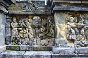 Human figures and decorative stone reliefs on Borobudur’s walls.