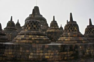 Perforated stone stupas on Borobudur’s upper terrace.