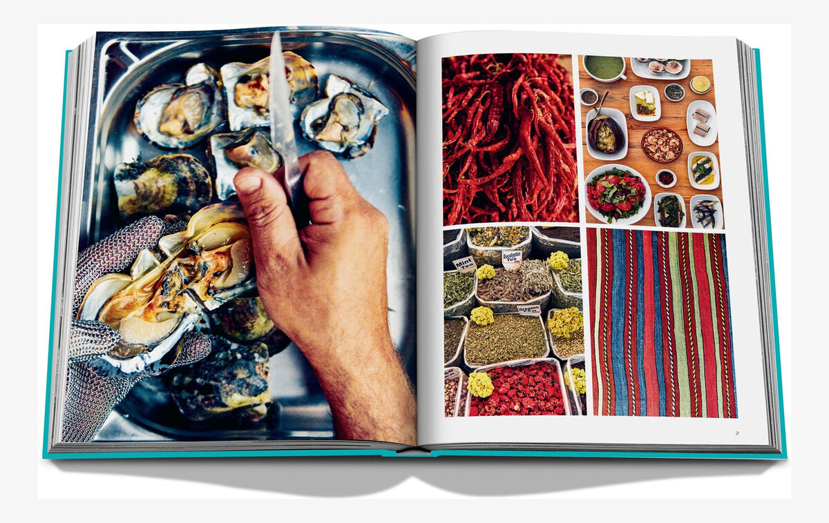 An open spread with shellfish, colourful spices and striped woven textiles.