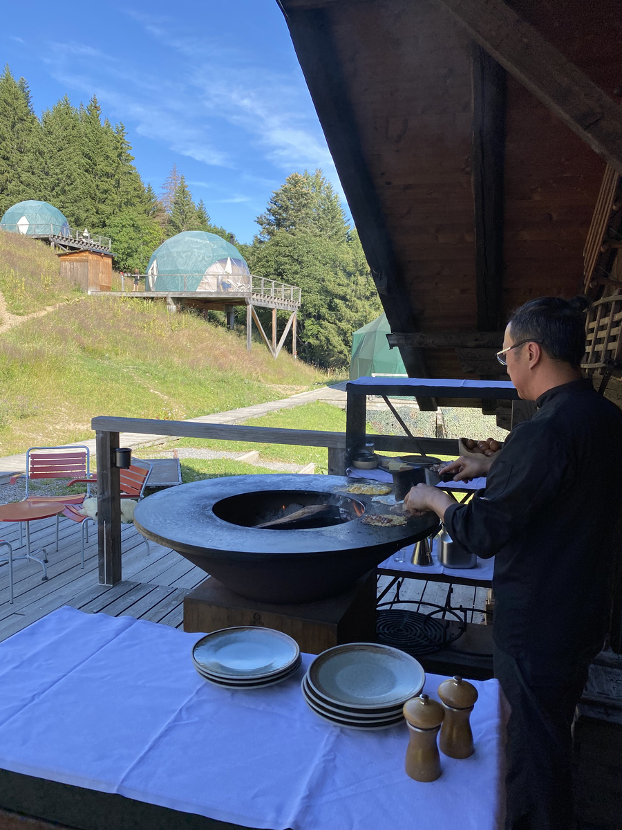 Breakfast being prepared beside an OFYR on the Pod-house terrace.