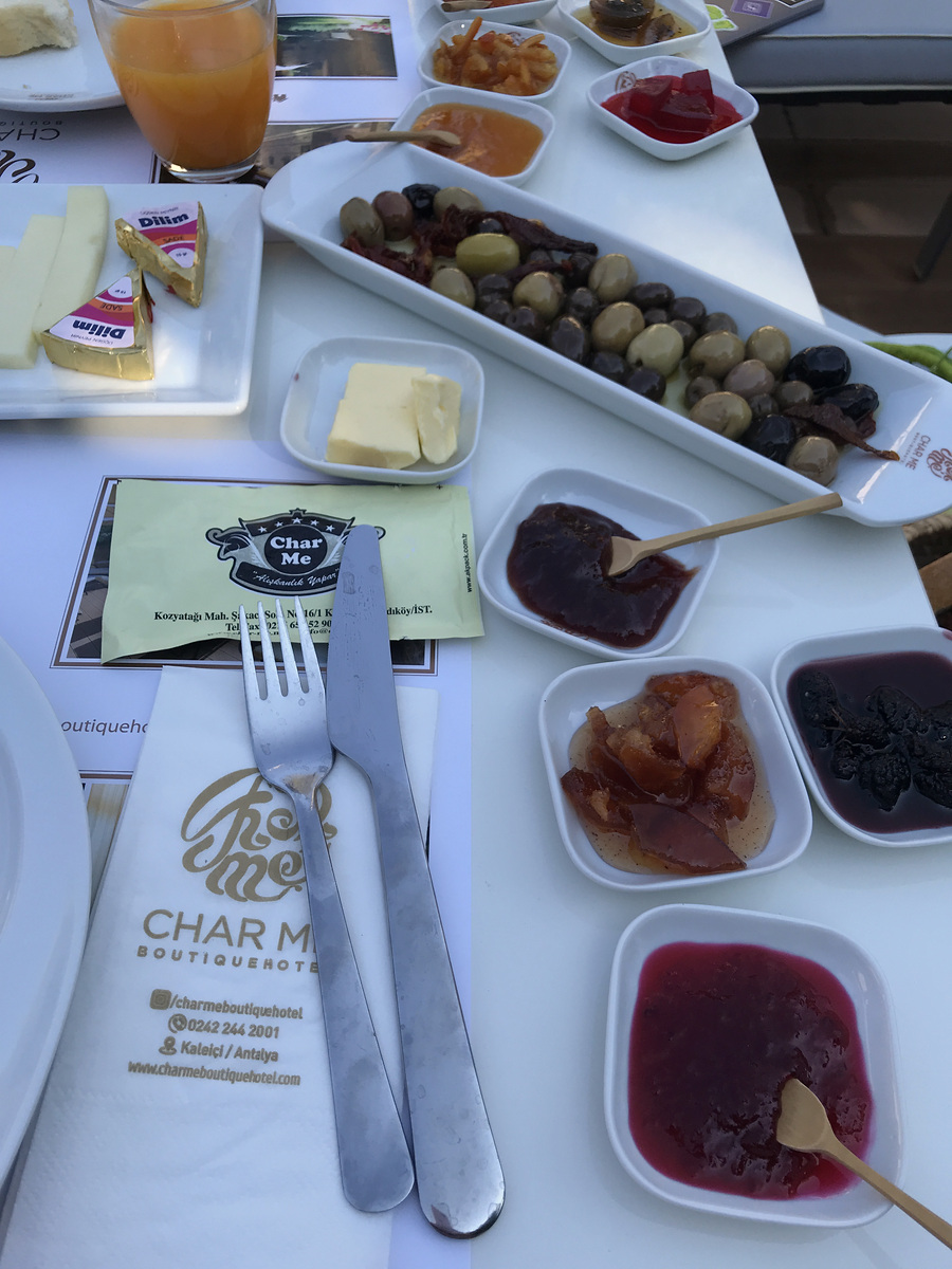 Breakfast dishes and the Char Me logo on the table setting.