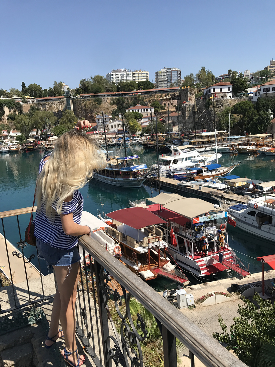 Olga looking over Antalya’s old harbour from a railing above the marina.