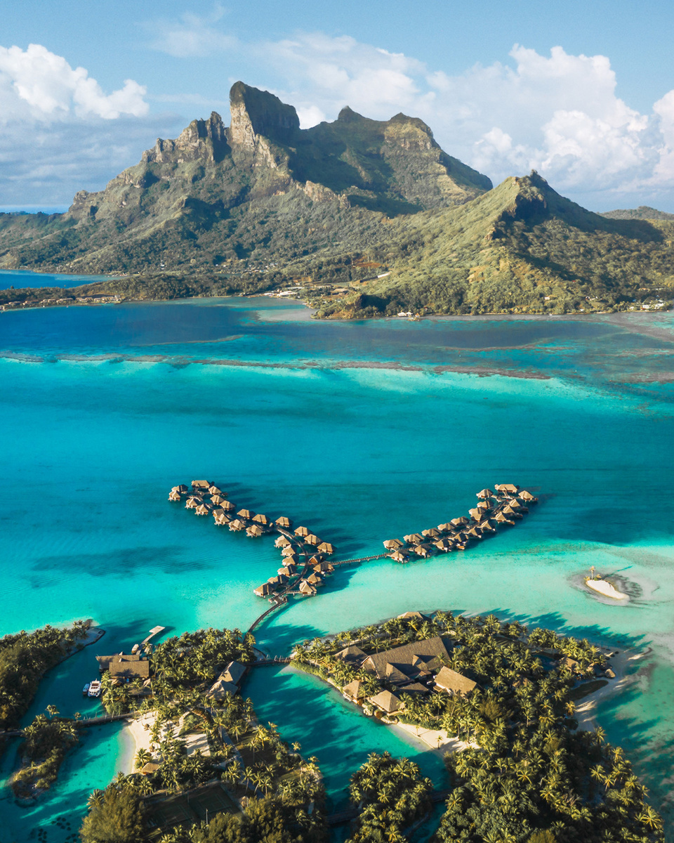 Aerial view of Four Seasons Bora Bora’s main resort area and branching overwater bungalow pontoons. Photograph: Four Seasons.