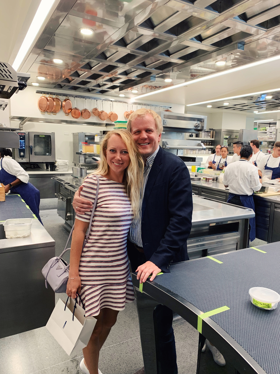 Olga and Konstantin together in The French Laundry kitchen, with chefs working behind them.