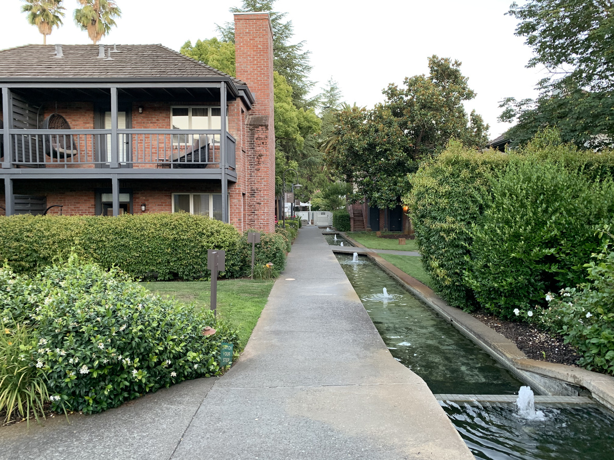 Fountain channel beside the garden path and balconies at Vintage House.